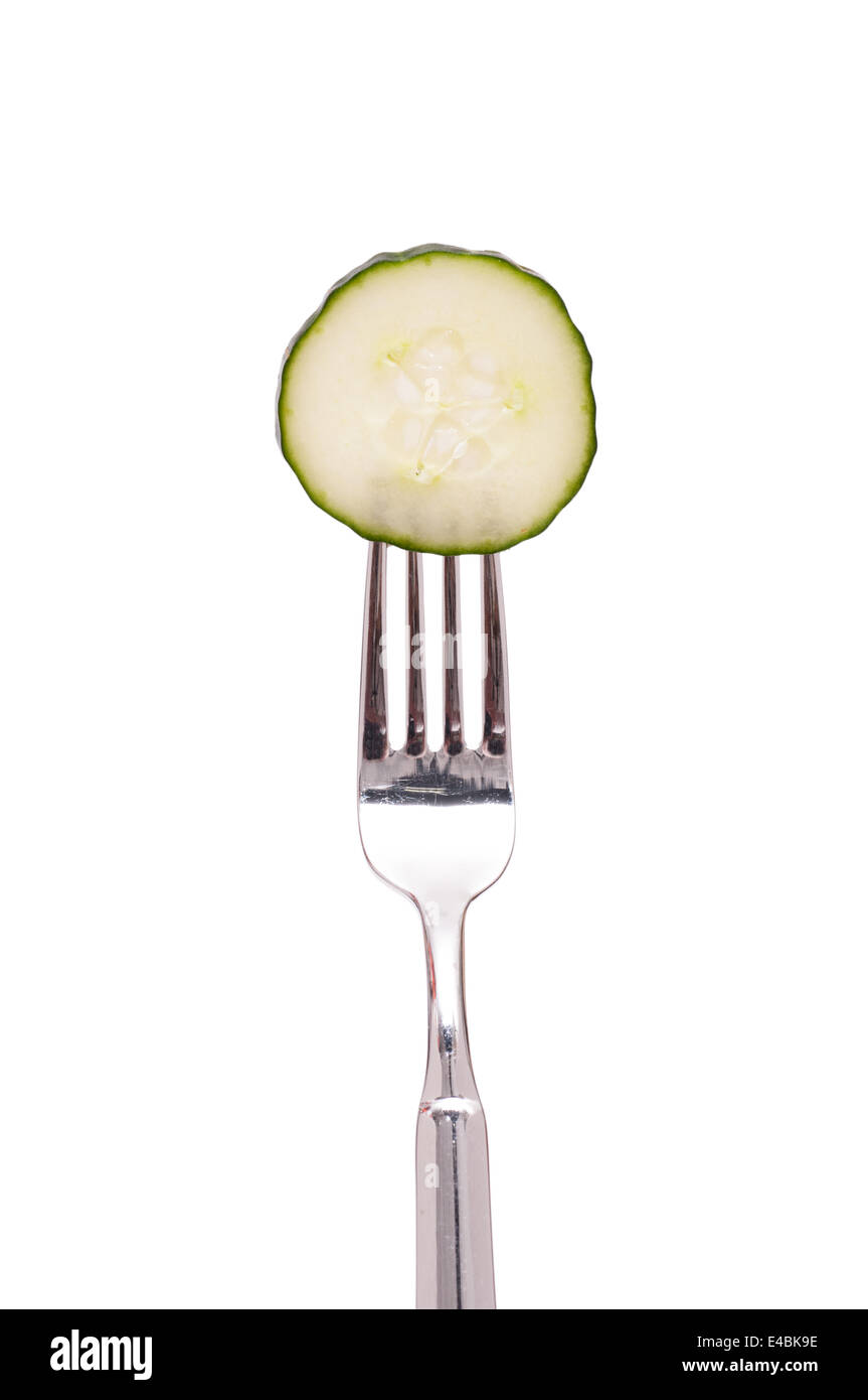 Slice of cucumber on a fork Stock Photo