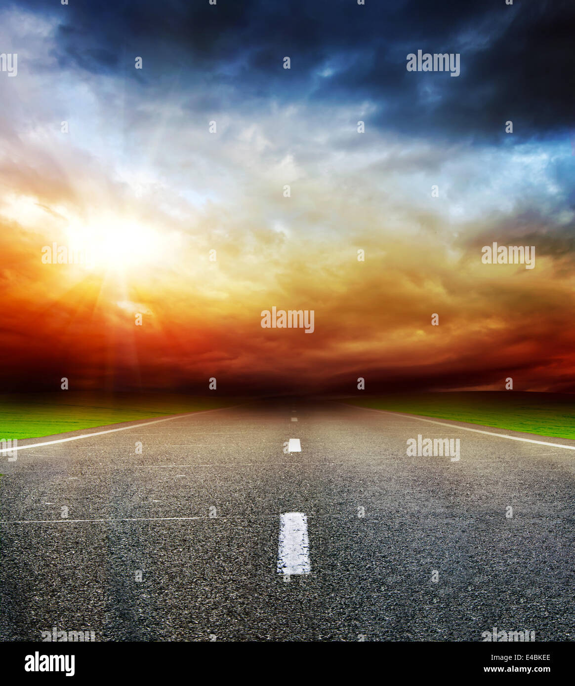 road in field over stormy dark cloudy sky Stock Photo - Alamy