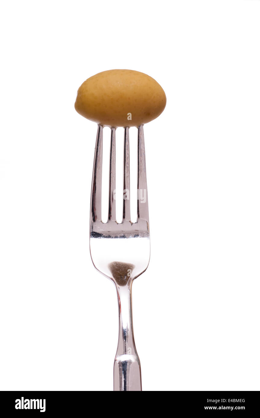 Green olive on a fork Stock Photo