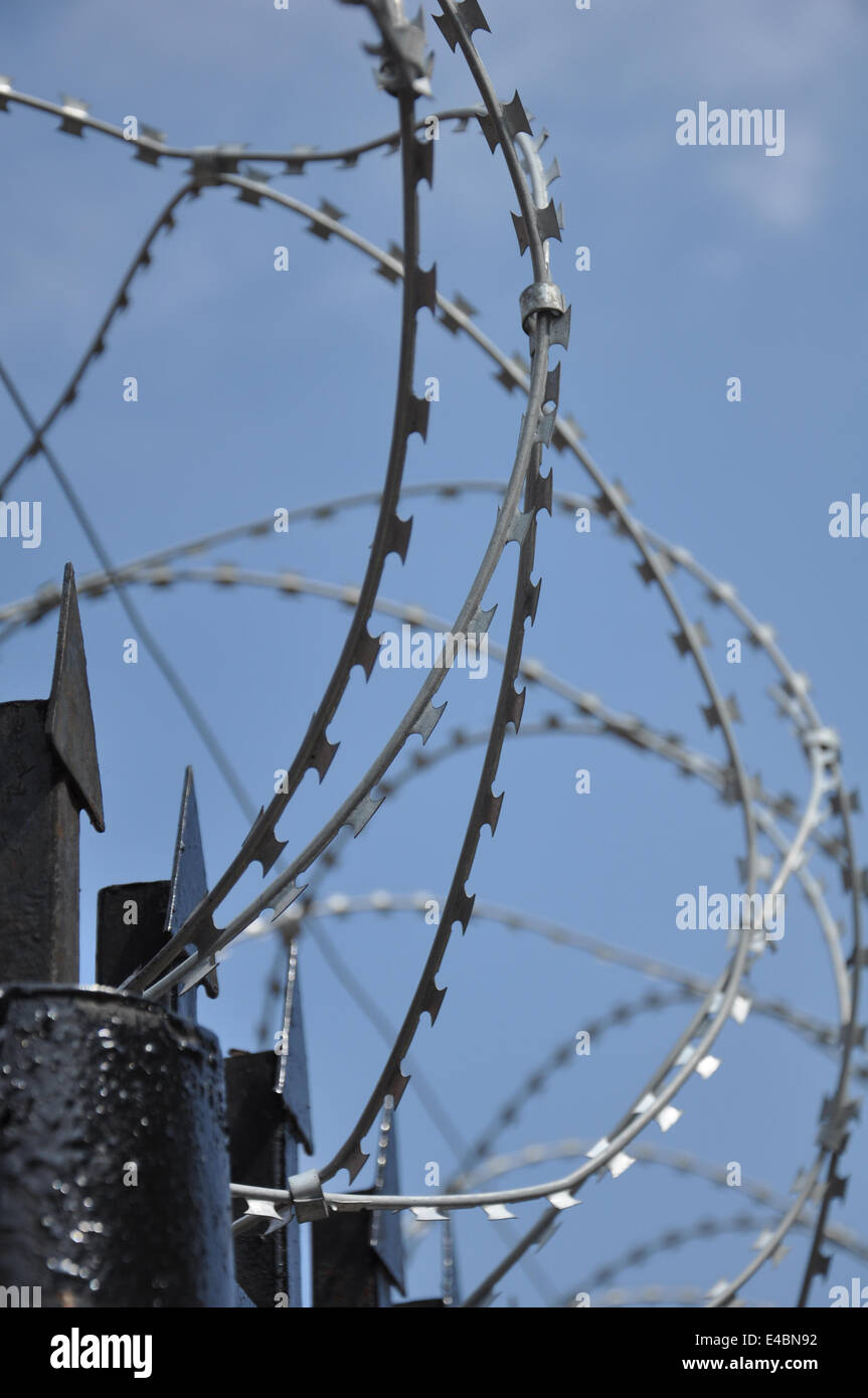 Barbed wire fence at the prison Stock Photo