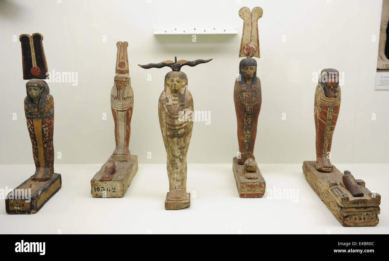 Wooden statuettes depicting Gods Ptah, Osiris and Seker bird. Archaeological Museum. Istanbul. Turkey. Stock Photo