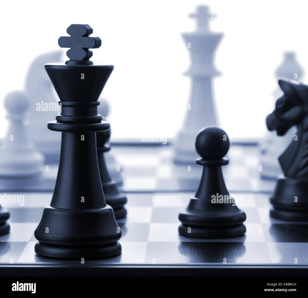The black chess king.Blue toned Stock Photo
