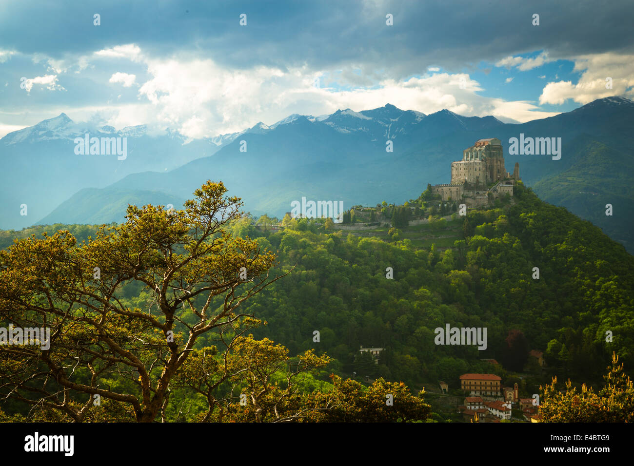 The monastery church of Sacra di San Michele in the Susa Valley, Italy. The Alps rise up in the background with Rocciamelone the most prominent peak. Stock Photo