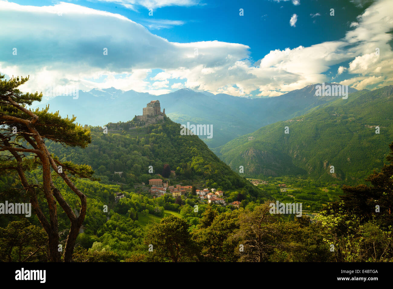 View of the monastery church of Sacra di San Michele in the Susa Valley, Italy. The Alps rise up in the background. Stock Photo