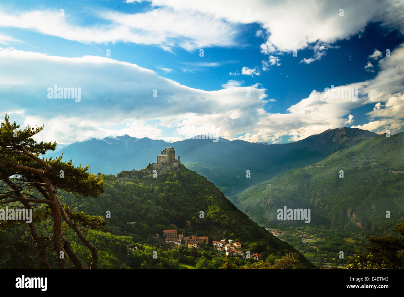 View of the monastery church of Sacra di San Michele in the Susa Valley, Piedmont, Italy. The Alps rise up in the background. Stock Photo