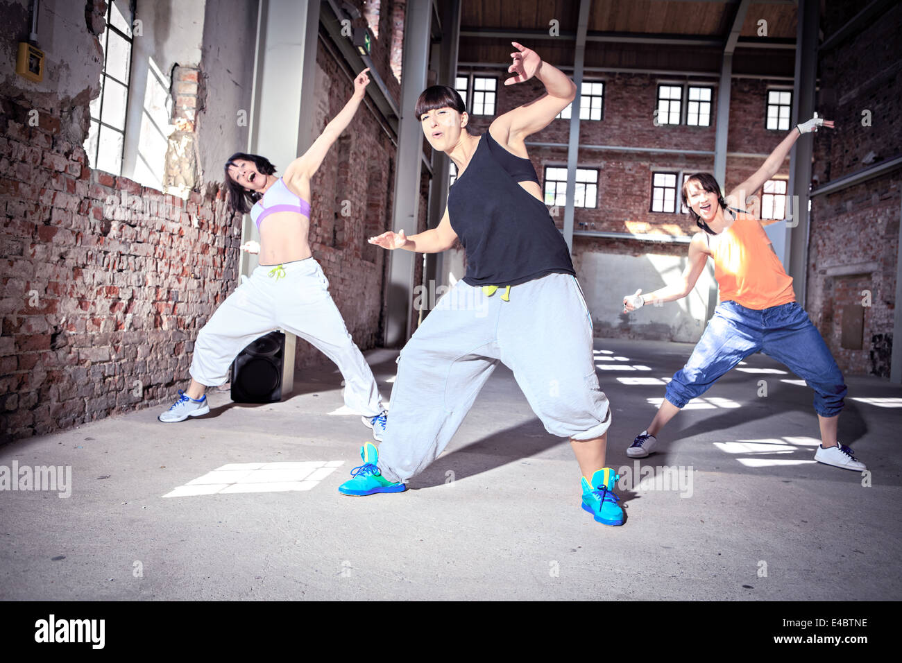 group of women in sport dress dancing zumba or aerobics Stock Photo Alamy