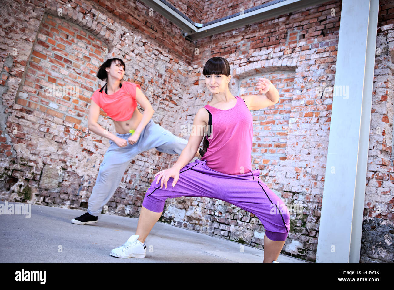 group of women in sport dress dancing zumba or aerobics Stock Photo Alamy