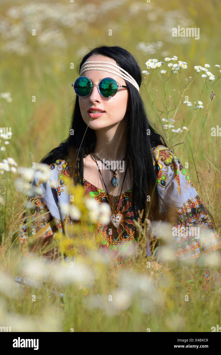 hippie girl on a flowering field Stock Photo