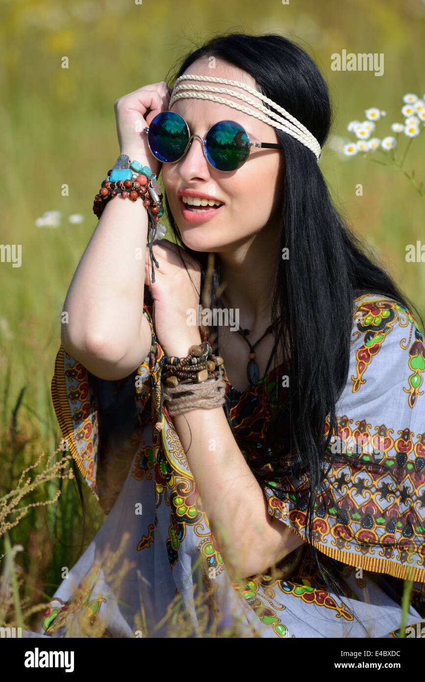 hippie girl on a flowering field Stock Photo - Alamy
