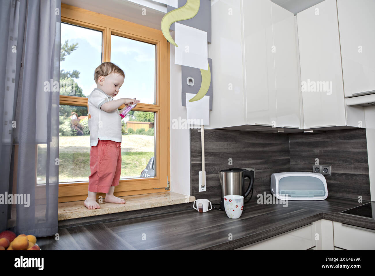 a 1,5 years old boy in the kitchen Stock Photo Alamy