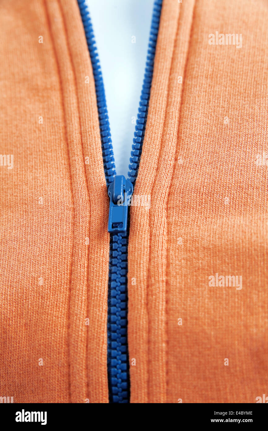 blue zipper on fashionable orange warm wear Stock Photo
