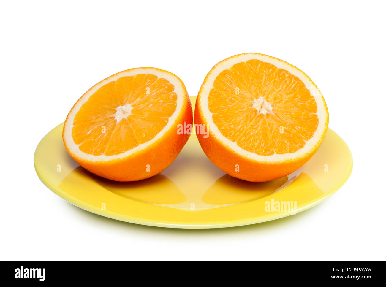 Cut orange on plate. Stock Photo