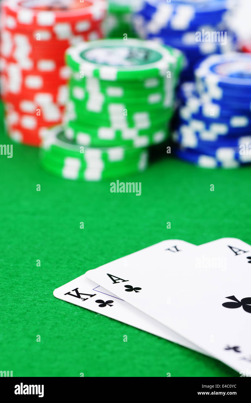 Gaming chips and cards on the green cloth Stock Photo