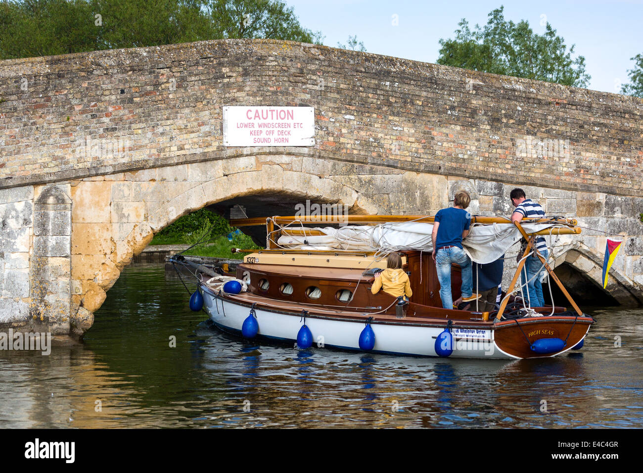 yacht passing under potter heigham bridge Norfolk Broads England UK Stock Photo