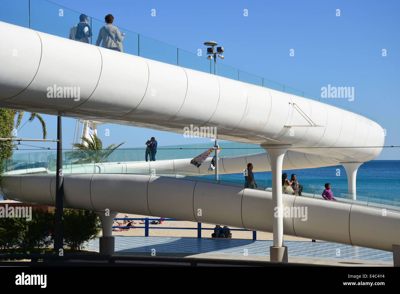 Modern footbridge over Calle Jovellanos, Playa del Postiguet, Alicante, Costa Blanca, Alicante Province, Kingdom of Spain Stock Photo