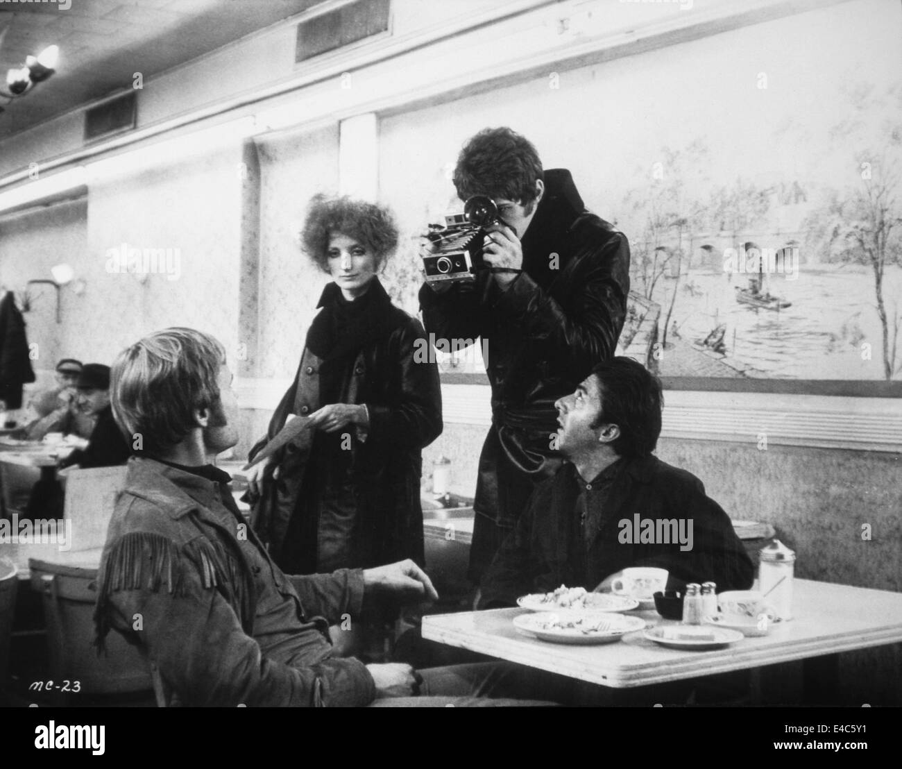 Jon Voight (seated L), Dustin Hoffman (seated R), on-set of the Film, 'Midnight Cowboy', 1969 Stock Photo