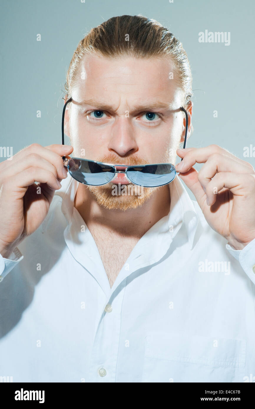 funny young man with sunglasses Stock Photo Alamy