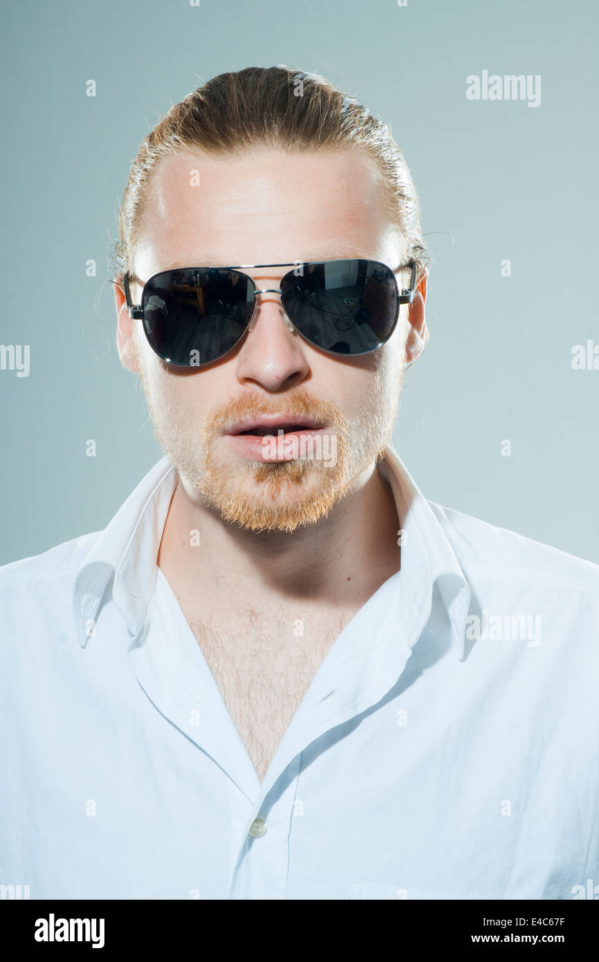 funny young man with sunglasses Stock Photo Alamy