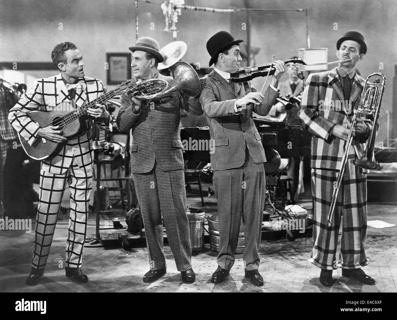 Spike Jones (Left) and his City Slickers, Mickey Katz (Far R), on-set of the Film, 'Fireman Save my Child', 1954 Stock Photo