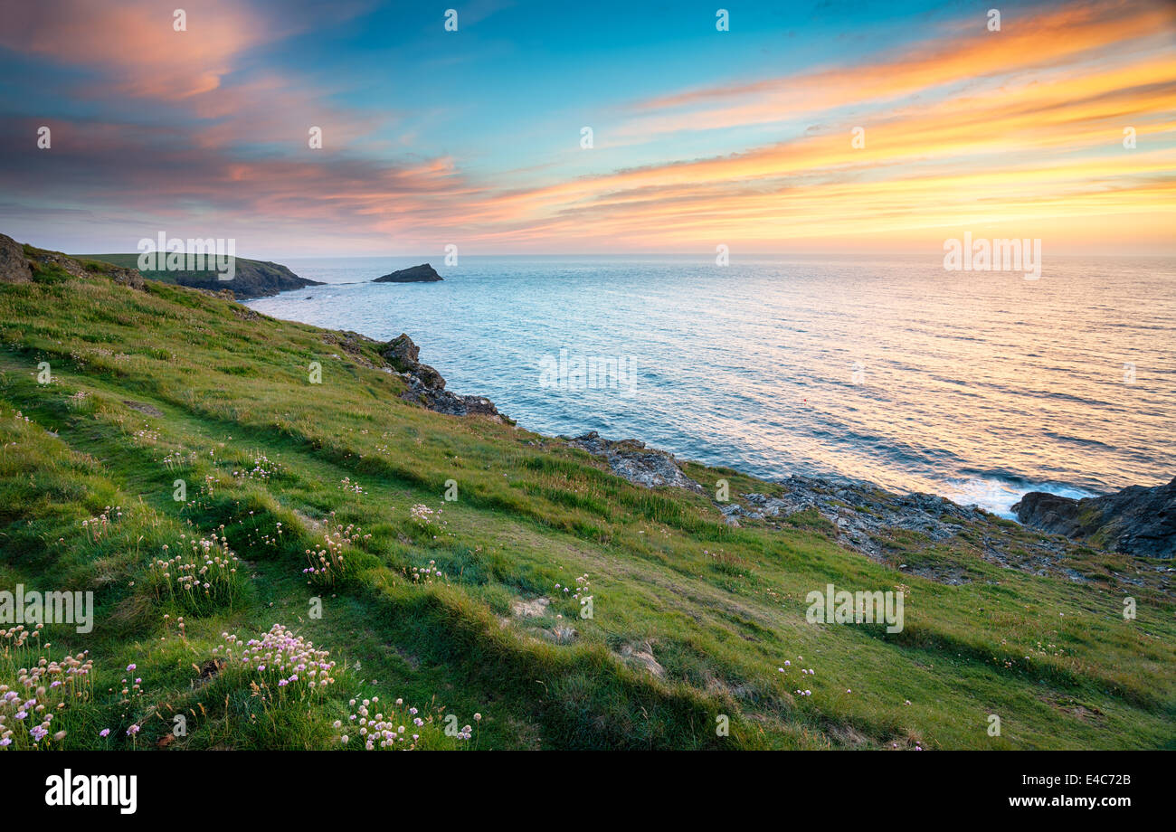 Sunset on cliffs at West Pentire above Crantock near Newquay in Cornwall Stock Photo