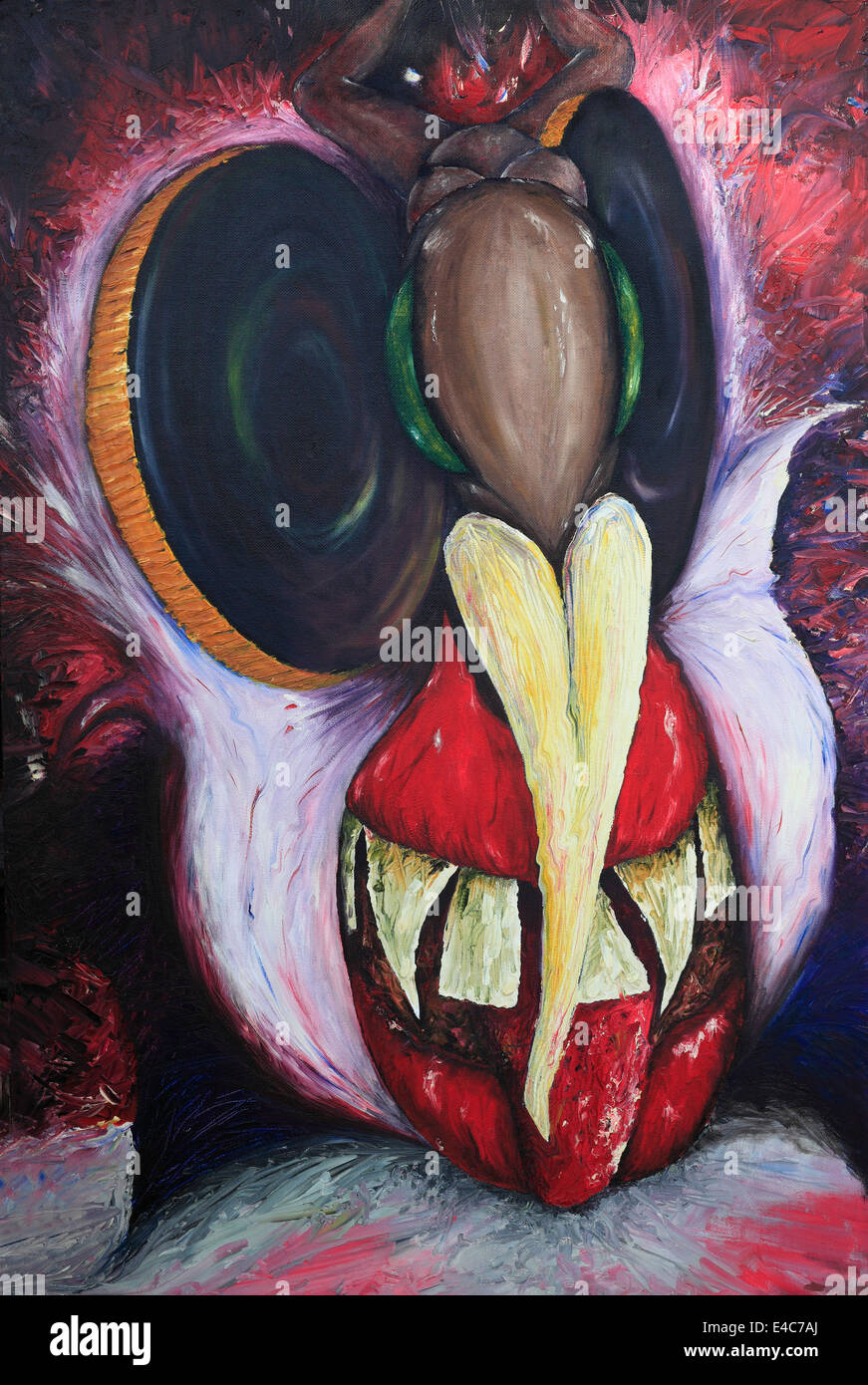 Photograph of a painting of a demon-like face. Stock Photo
