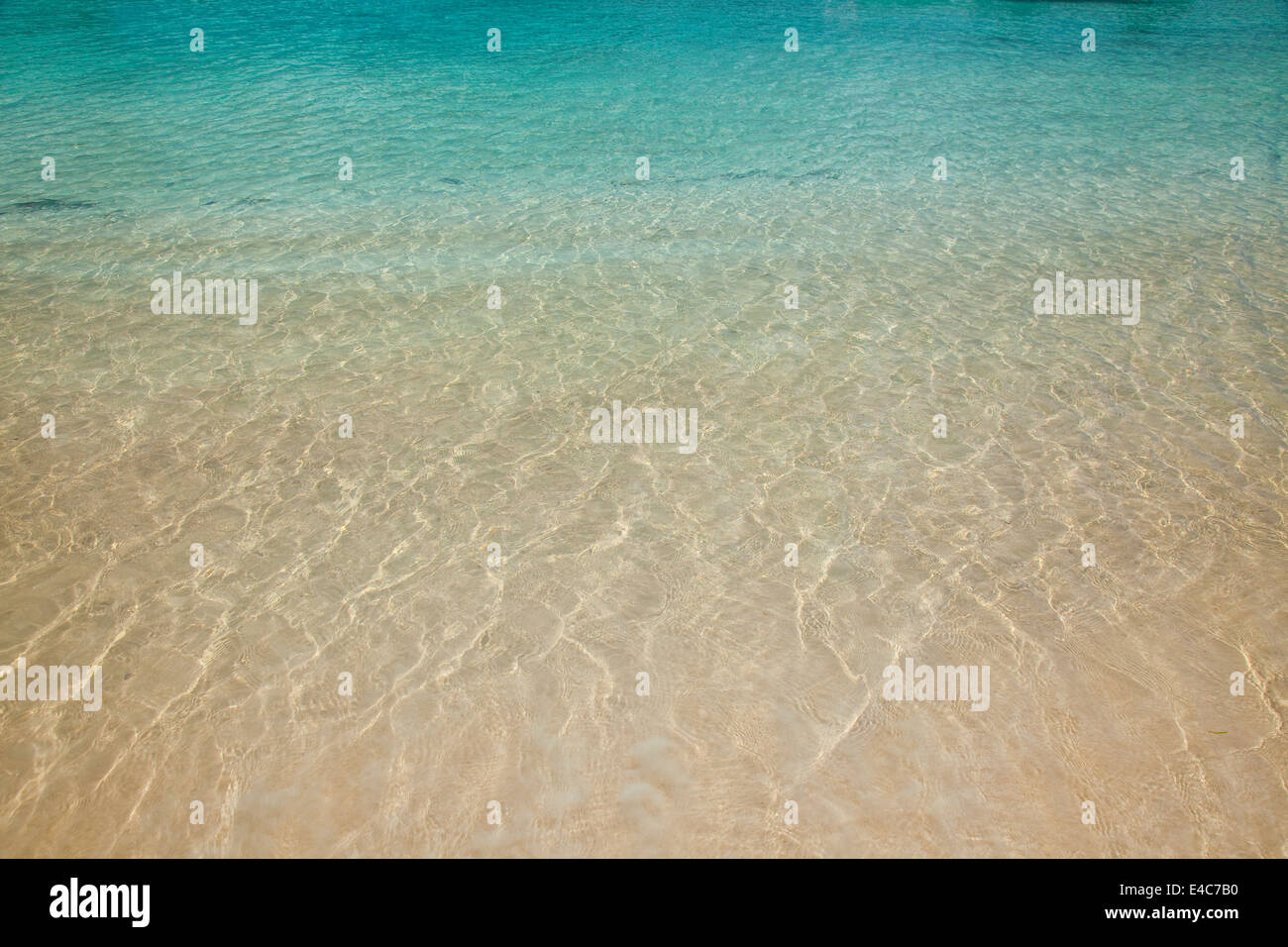 Crystal clear watersurface at the beach Stock Photo