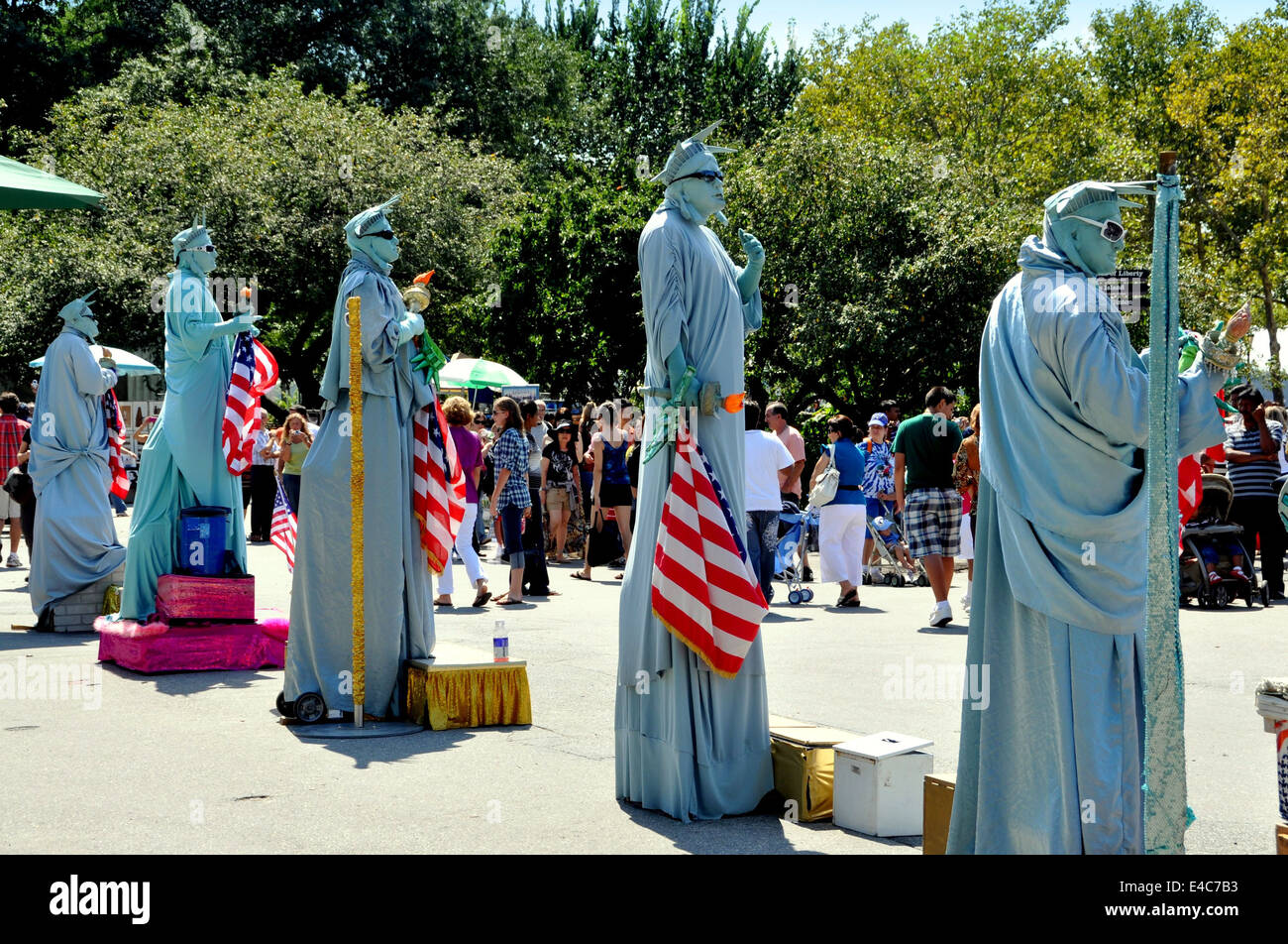 NYC A row of HUMAN Statue of Liberty mimes await customers to pose