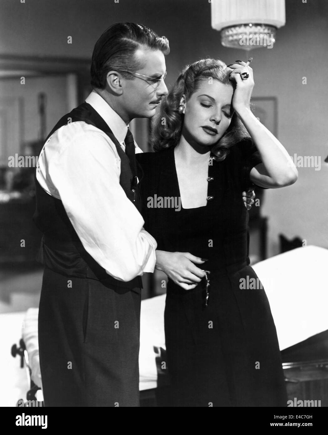 Kent Smith, Ann Sheridan, on-set of the Film, 'Nora Prentiss', 1947 Stock Photo