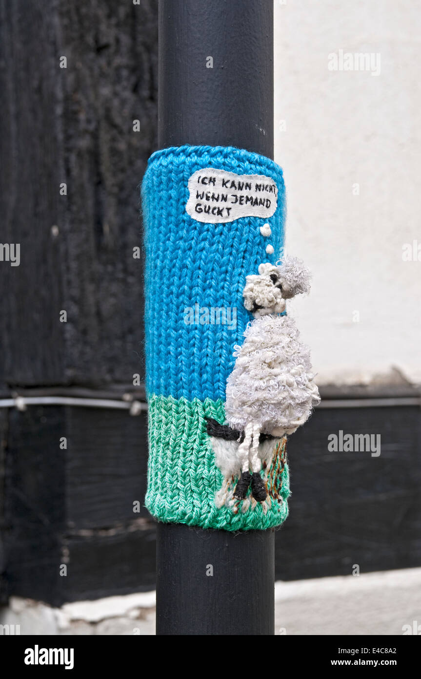Guerilla knitting of a dog defecating in the town of  Freudenberg, NRW, Germany. Stock Photo