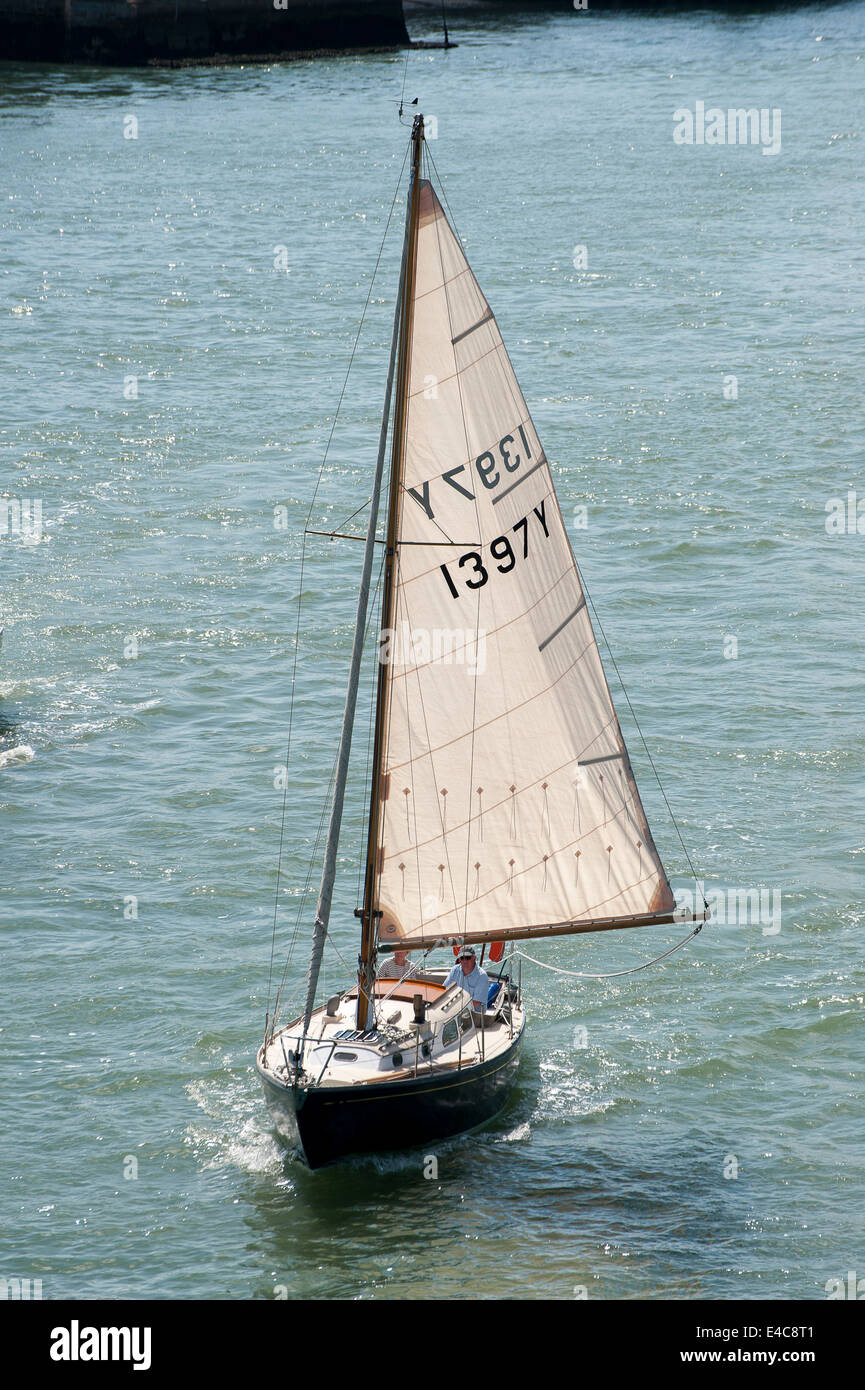 Yacht sailing just off the coast of Cowes on the Isle of Wight, England