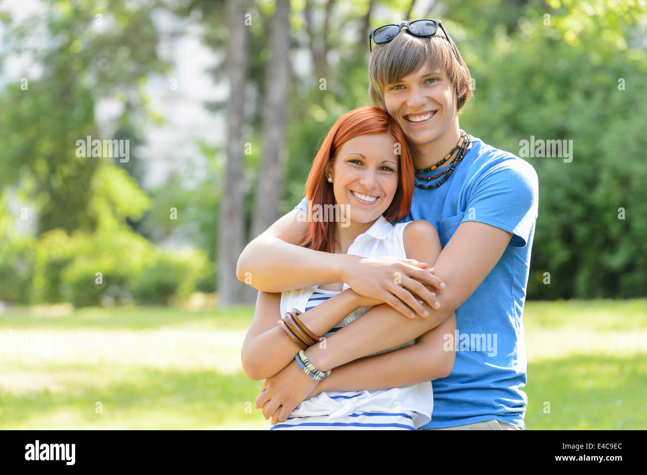 Teenage couple hugging in park hi-res stock photography and images - Alamy
