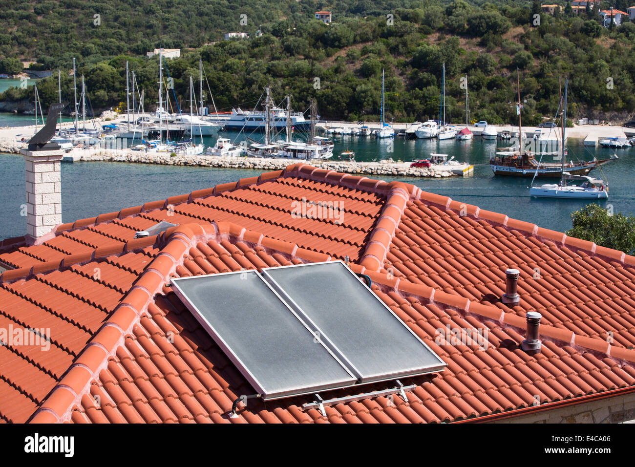Solat thermal panel for heating water on a house roof in Sivota, Greece. Stock Photo