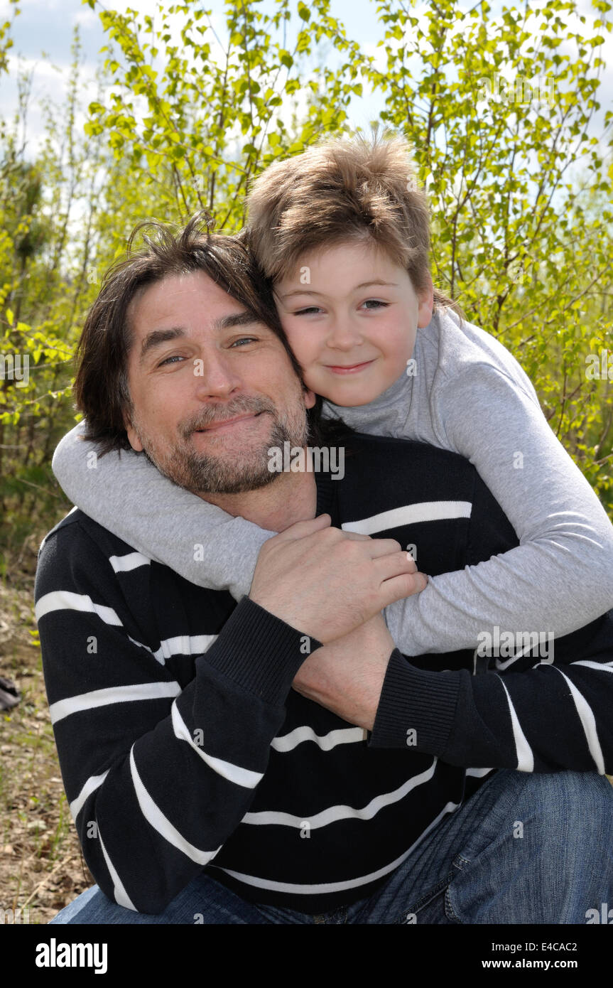 Dad and son relaxing outdoors Stock Photo Alamy