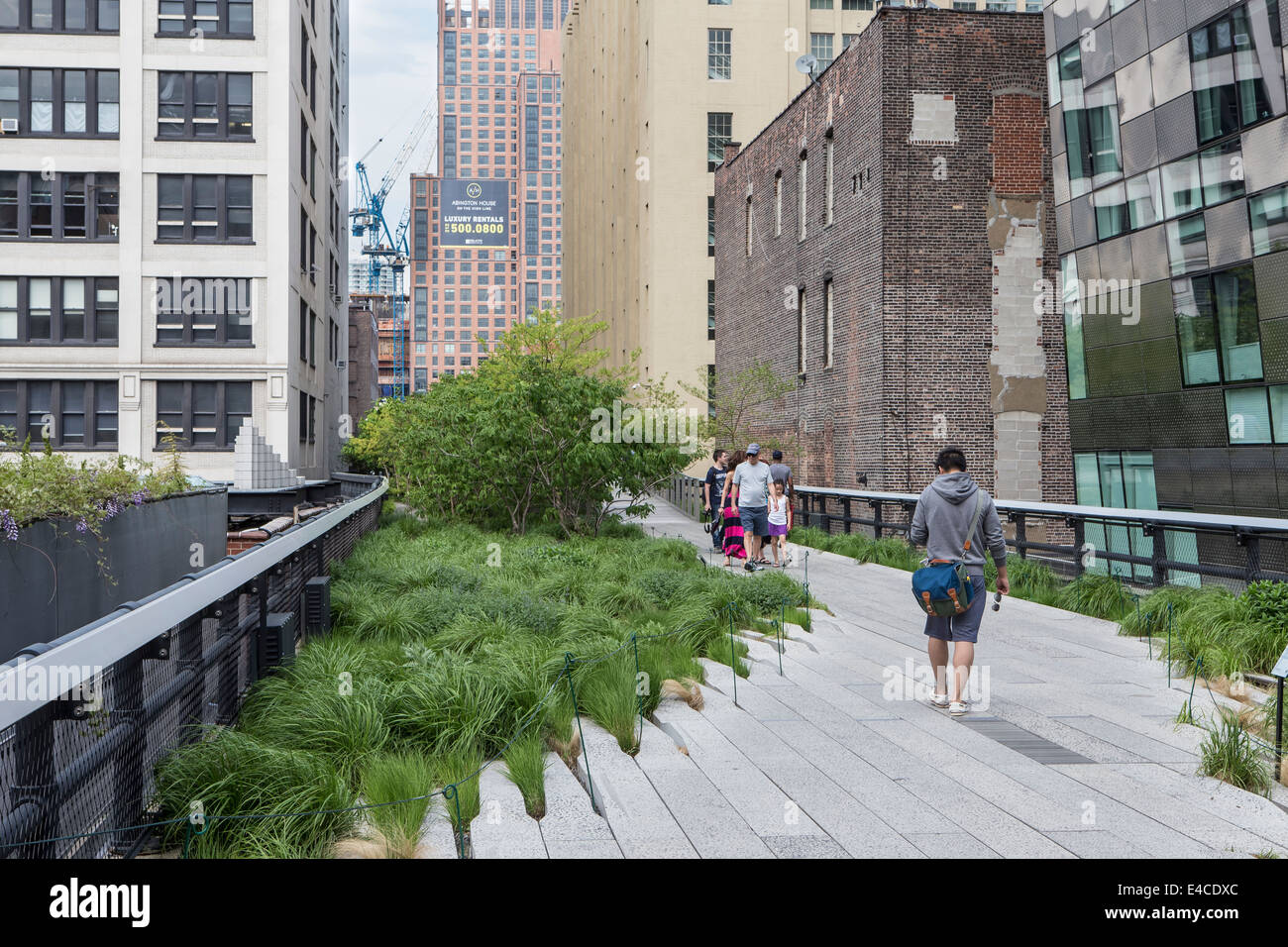 Pedestrians walk on High Line Park in the New York City borough of Manhattan, NY Stock Photo