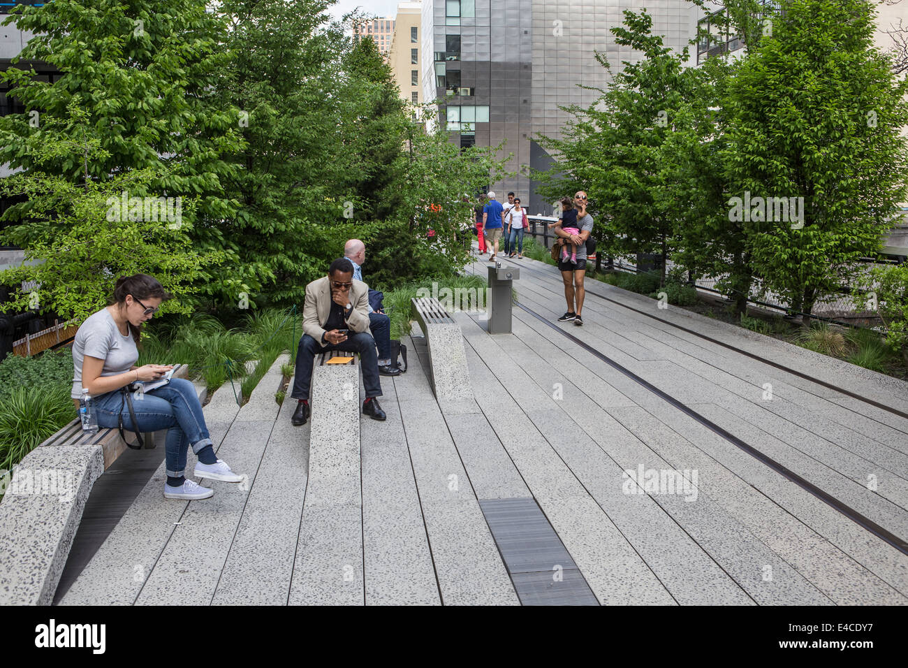 Pedestrians walk on High Line Park in the New York City borough of ...