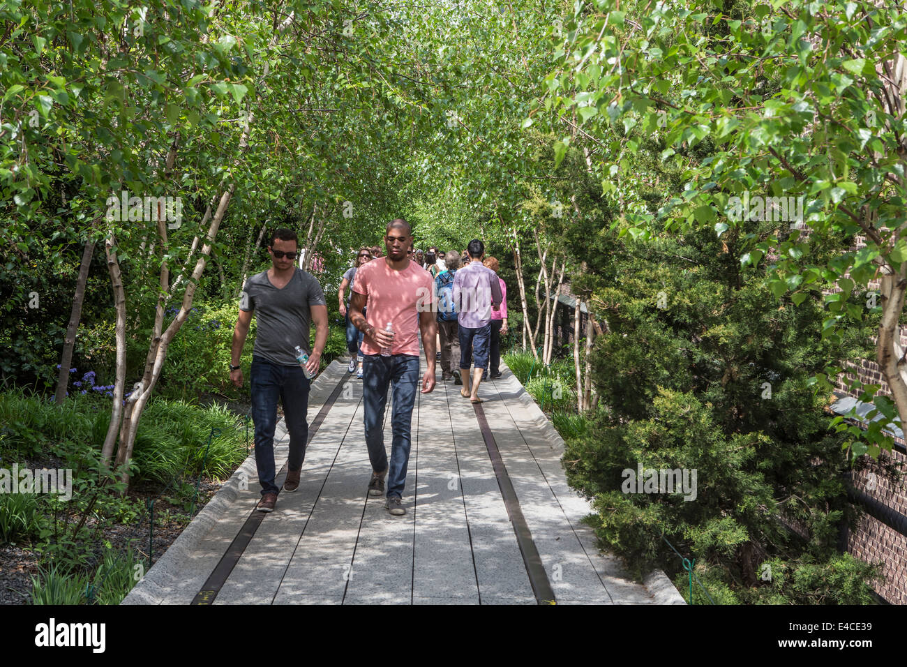Pedestrians walk on High Line Park in the New York City borough of ...