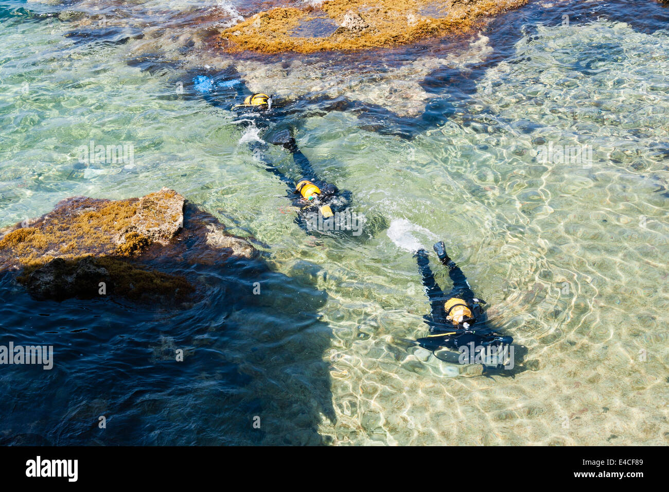 Scuba divers at Cirkewwa, a popular dive spot on the Mediterranean island of Malta Stock Photo
