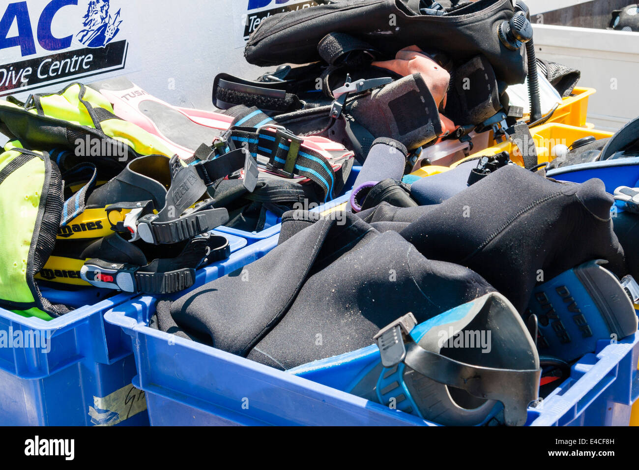 Boxes of scuba diving kit/equipment, fins/wetsuits and bcd, Malta. Stock Photo