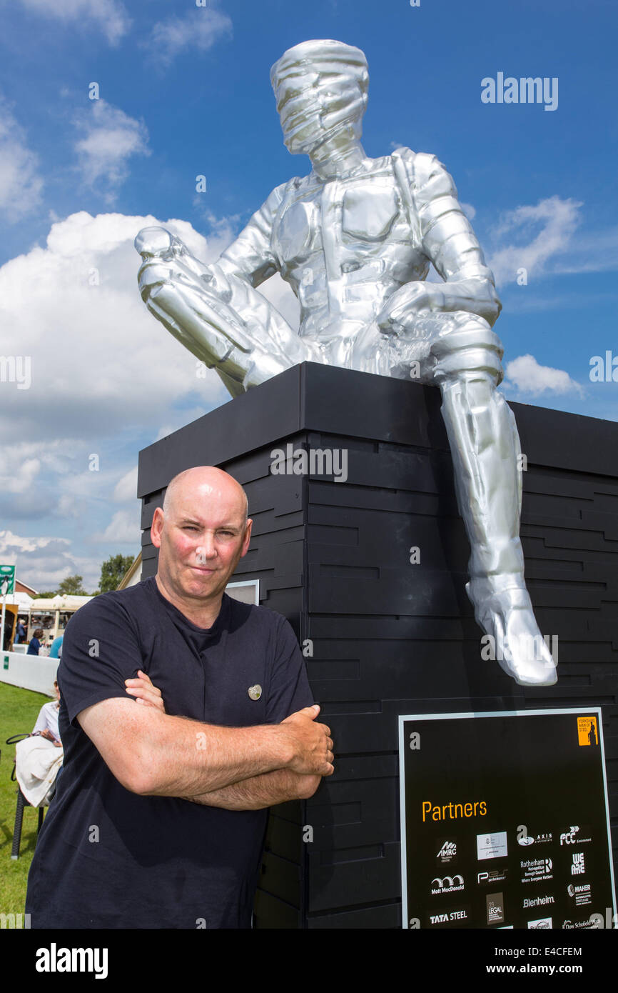 Harrogate, North Yorkshire, UK. 8th July 2014 - The 156th Great Yorkshire Show began today in Harrogate, North Yorkshire. Artist Steve Mehdi with a scale model of The Yorkshire Man of Steel, a 40m high sculpture he is creating. The full size sculpture is to be placed on the site of the former Tinsley cooling towers next to the M1 in Sheffield and made, as the name suggests, of steel. Credit:  Thomas Holmes/Alamy Live News Stock Photo