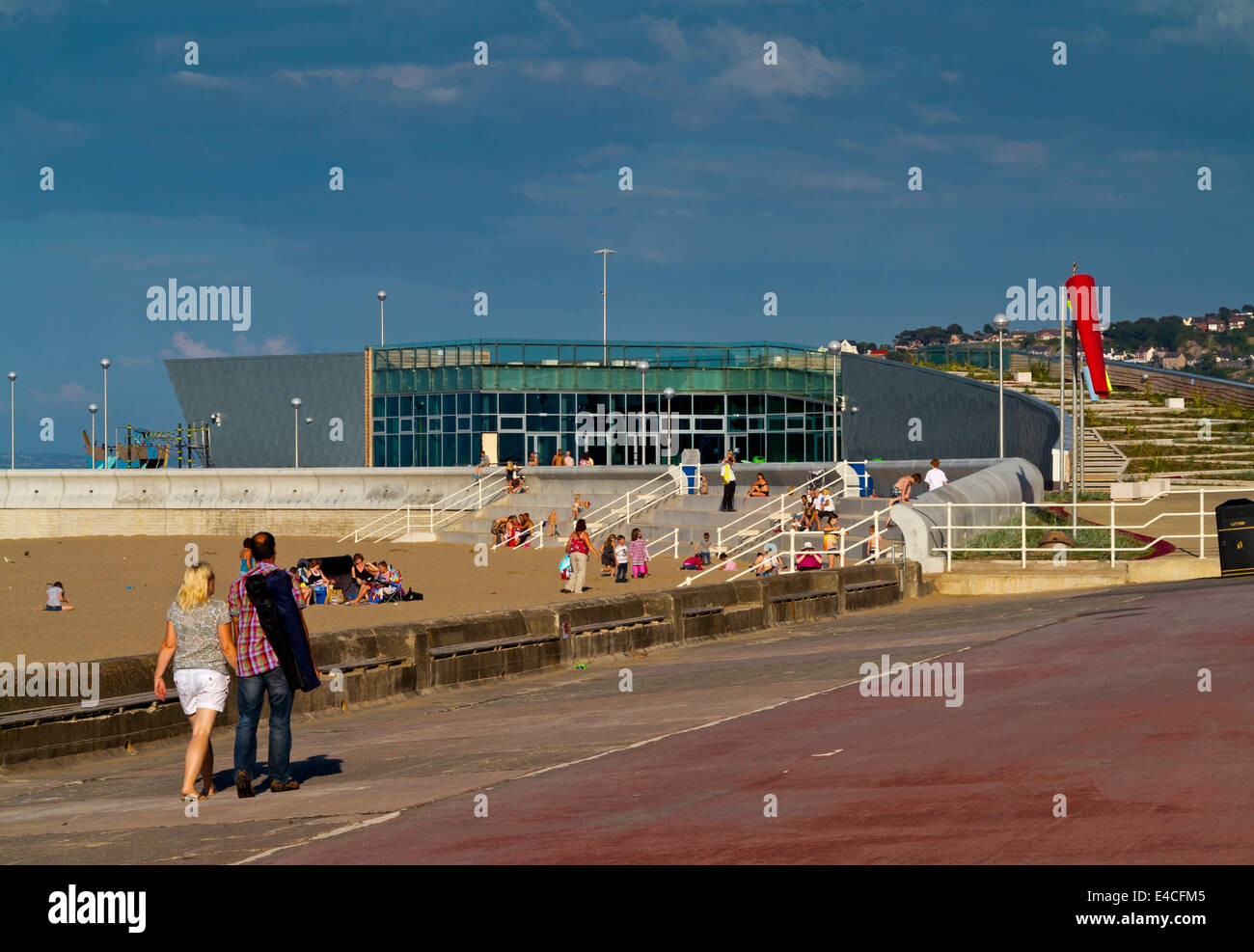 The beach at Colwyn Bay in Conwy North Wales UK looking towards Porth Eirias watersports centre which opened in 2013 Stock Photo