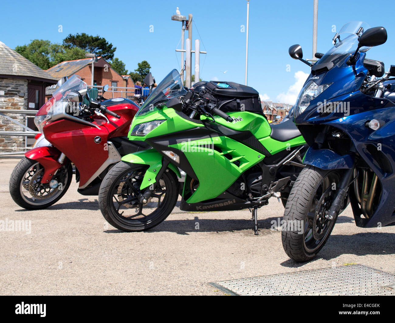 Three motorbikes in a row, Padstow, Cornwall, UK Stock Photo Alamy