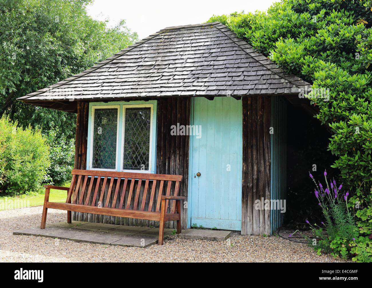 garden shed with bench seat outside Stock Photo