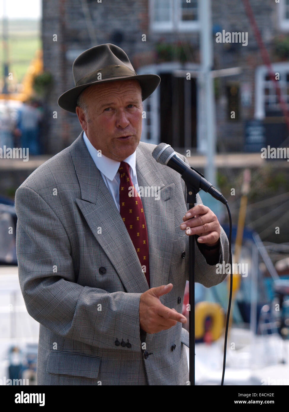 Older man busking, Padstow, Cornwall, UK Stock Photo