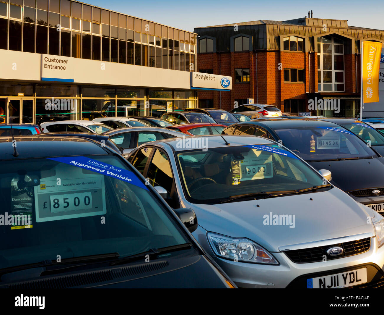 Used cars for sale on a Ford dealers forecourt in Redhill Surrey England UK Stock Photo