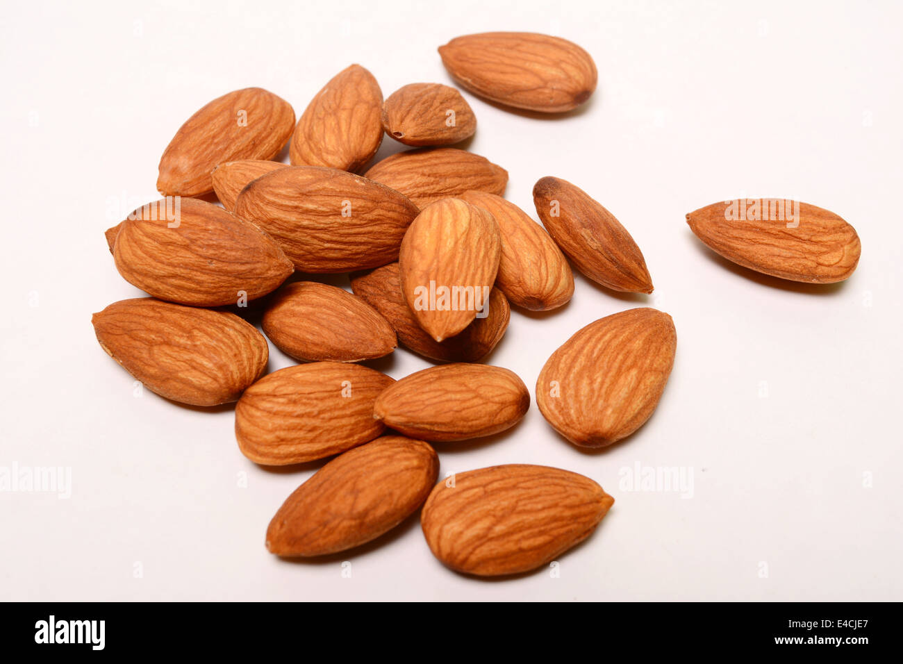 Unshelled almonds on a white background Stock Photo Alamy