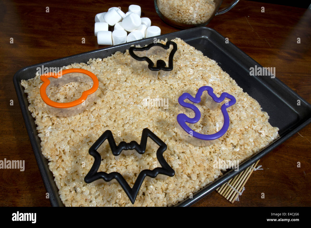 Puffed rice cereal treats in a tray with halloween shaped cookie