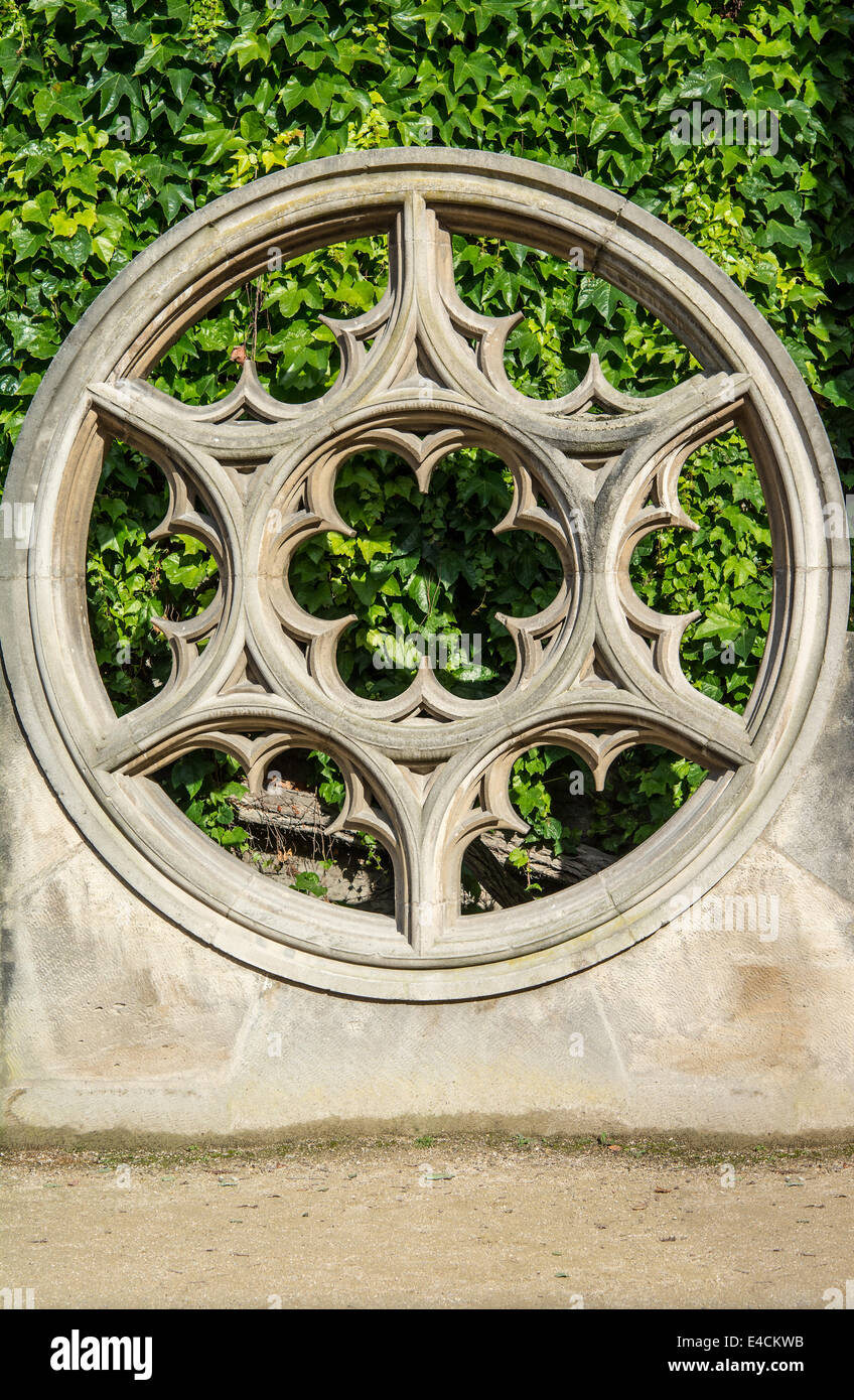 Rose window made of stone at place de vosge. rose window, also called wheel window, in Gothic architecture, decorated circular w Stock Photo