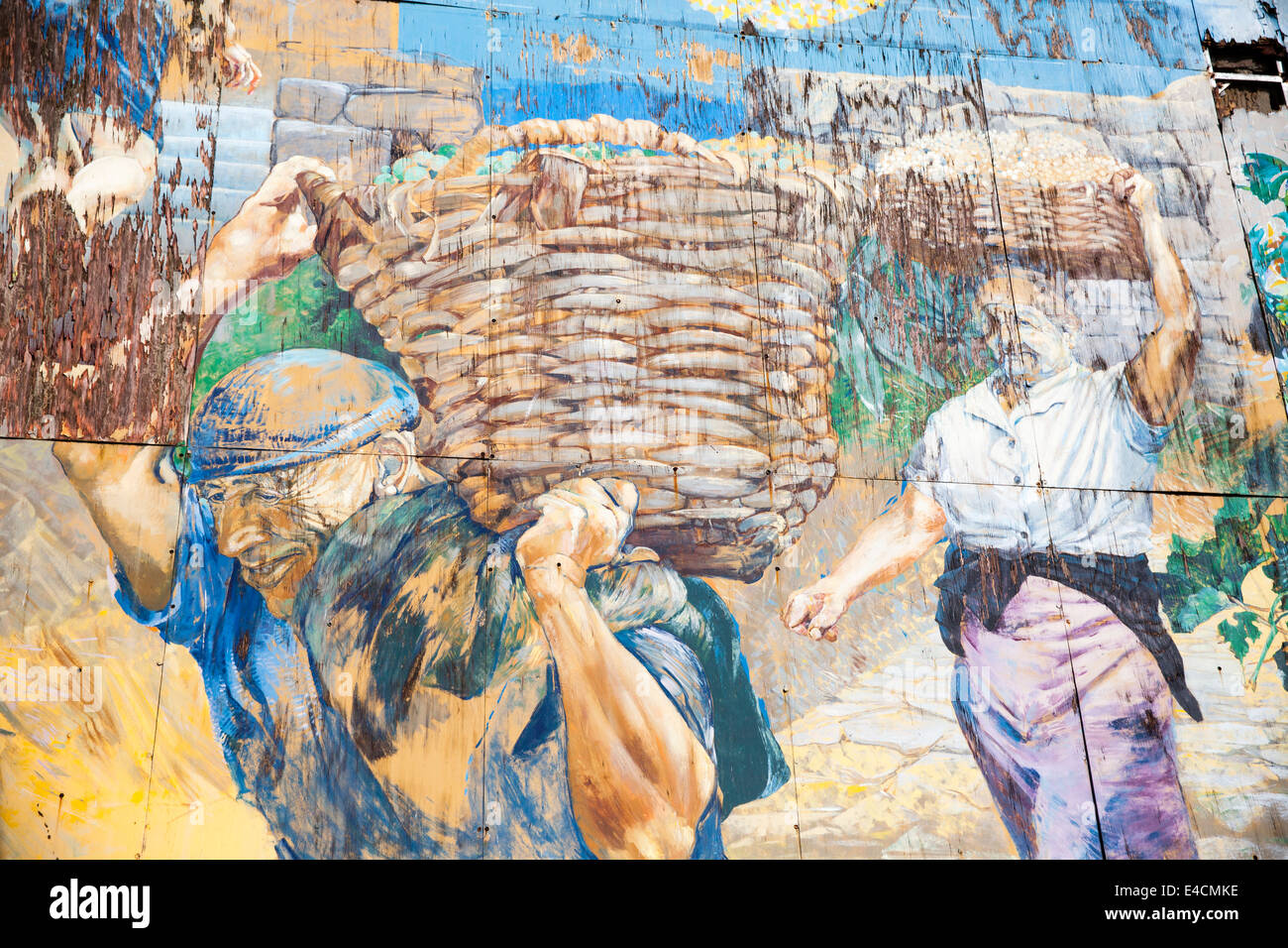 Mural in Riomaggiore showing traditional grape harvesters. Stock Photo