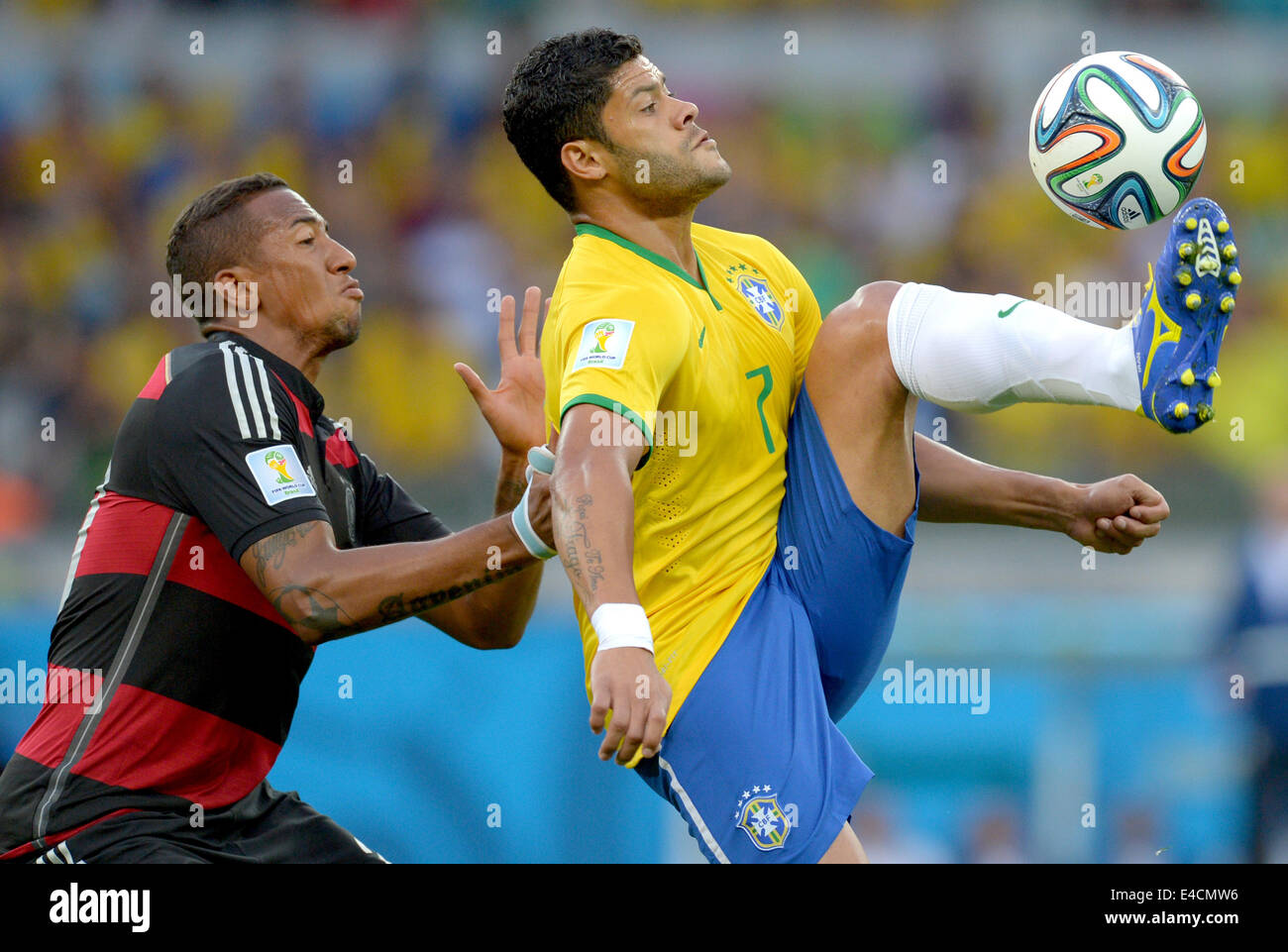 Belo Horizonte, Brazil. 08th July, 2014. Germany's Jerome Boateng (L) and Brazil's Hulk vie for the ball during the FIFA World Cup 2014 semi-final soccer match between Brazil and Germany at Estadio Mineirao in Belo Horizonte, Brazil, 08 July 2014. Photo: Thomas Eisenhuth/dpa/Alamy Live News Stock Photo