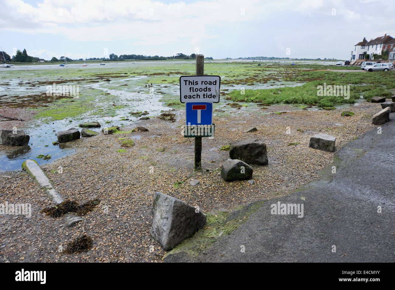 This road Floods Each Tide warning sign to parked cars at Bosham